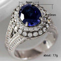 Deep Blue Oval Double-Halo Ring In Polished Silver Tone view 2