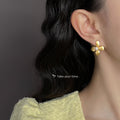 Gold Matte Brushed Four Petal Flower Studs White Pearl Center view 2