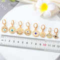 Gold Tone Ornate Evil Eye Medallion Huggie Earrings in Eight Designs view 5