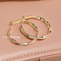Irregular Twisted Large Hoop Earrings In Gold And Silver Tone view 3