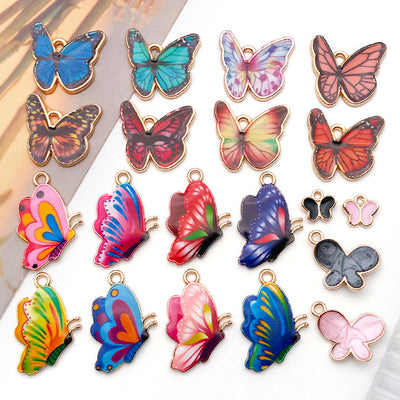 Colorful butterfly charms arranged on a light background