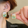 Pastel Garden Floral Oval Stud Earrings With Gold Trim view 1