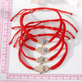 Gold Tone Crystal Hamsa Blue Evil Eye Red Cord Bracelets in Four Designs view 5