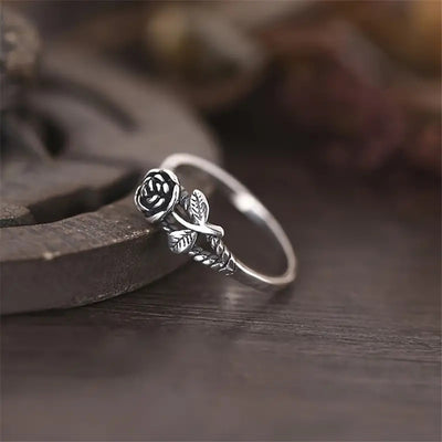 Product view showing small sculpted rose and leaf ring