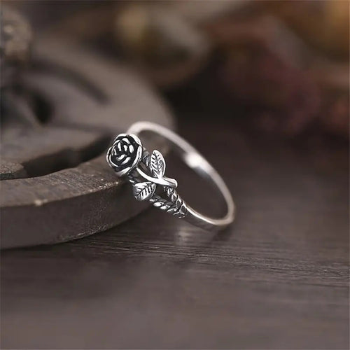 Product view showing small sculpted rose and leaf ring