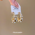 Gold Tone Chunky Hoop Earrings With White Pearl Border Accents view 3