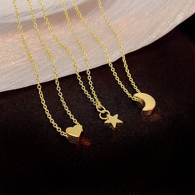 Gold mini heart star and crescent moon pendant necklaces together