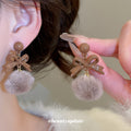 Bow and Faux Fur Pom Pom Stud Earrings in Taupe and Red view 4
