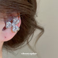 Crystal Clover Ear Clip with Silver Tone Setting and Clear Stones view 1