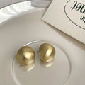 Brushed Gold Tone Domed Round Stud Earrings With Metal Details view 3