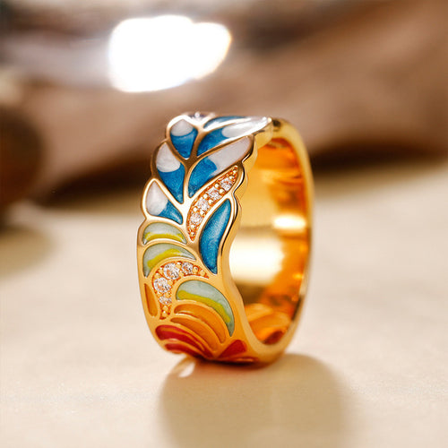 Second product view showing gold-tone multicolor enamel leaf pattern wide ring