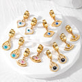 Gold Tone Evil Eye Huggie Drop Earrings in Five Designs view 1