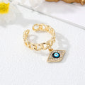Gold Tone Curb Chain Crystal Evil Eye and Hamsa Charm Rings view 3