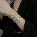 Two Wide Open Leaf Cuff Designs In Gold Or Silver Tone view 2