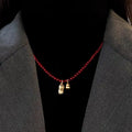 Dark Red Beaded Necklace with Gold Tone Bell Pendants view 2