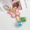 Pink Ombre Glitter Butterfly Keychain With Two Star Confetti Globes view 1