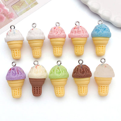 Multicolor ice cream charms arranged on a light background