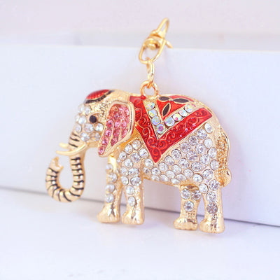 Close-up of the red rhinestone elephant charm with pink ear details.