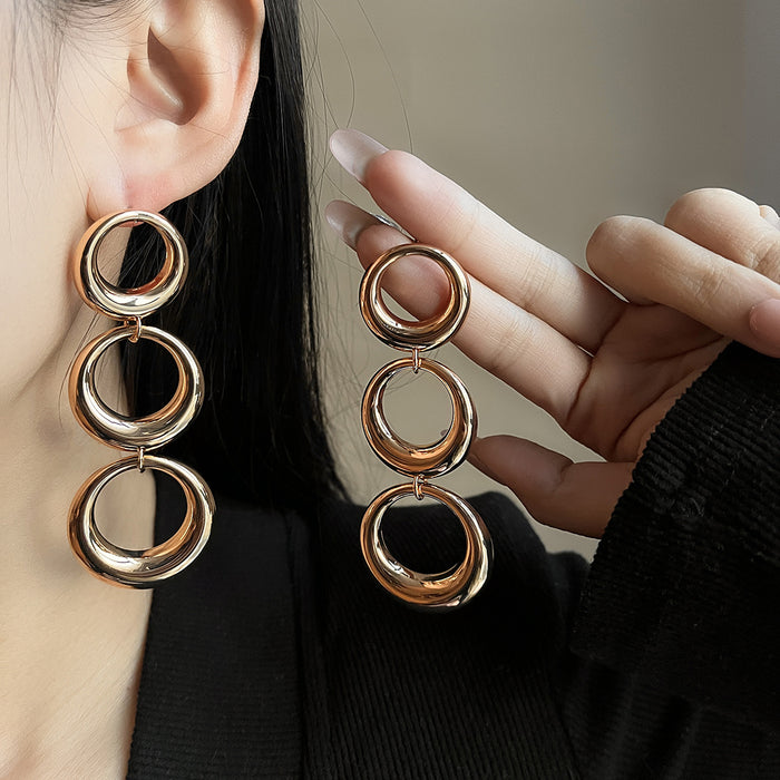 Gold Tone Triple Interlocking Ring Dangle Earrings