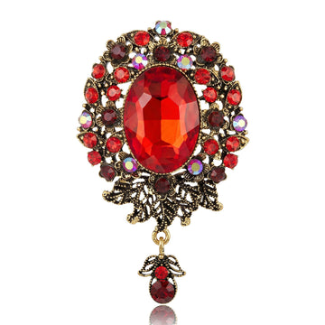 Antique Oval Crystal Dangle Brooch With Faceted Crystals And Polished Metal Details