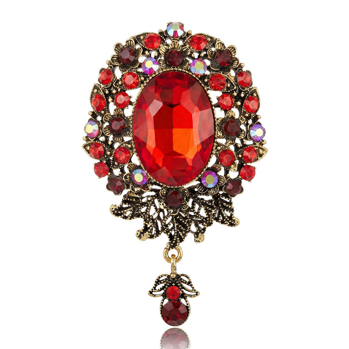 Antique Oval Crystal Dangle Brooch With Faceted Crystals And Polished Metal Details