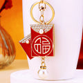 Red Enamel Fortune Envelope Keychain with Pearl Like Bead Drop view 1