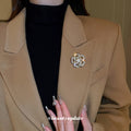 Gold Tone Crystal Fish Brooch With Pearl Like Orb Detail view 4