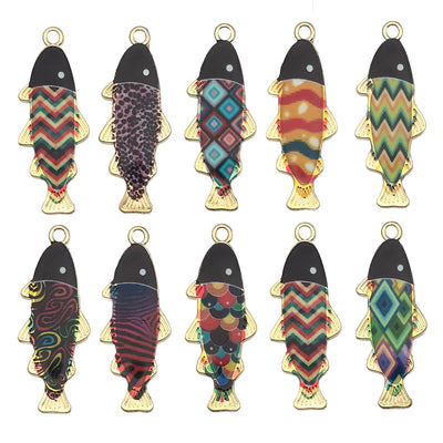 Colorful fish charms arranged on a light background