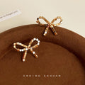 Gold 3D Cube Segment Bow Stud Earrings Geometric Pair view 1