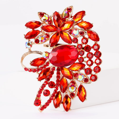 Red crystal floral brooch close-up center oval stone