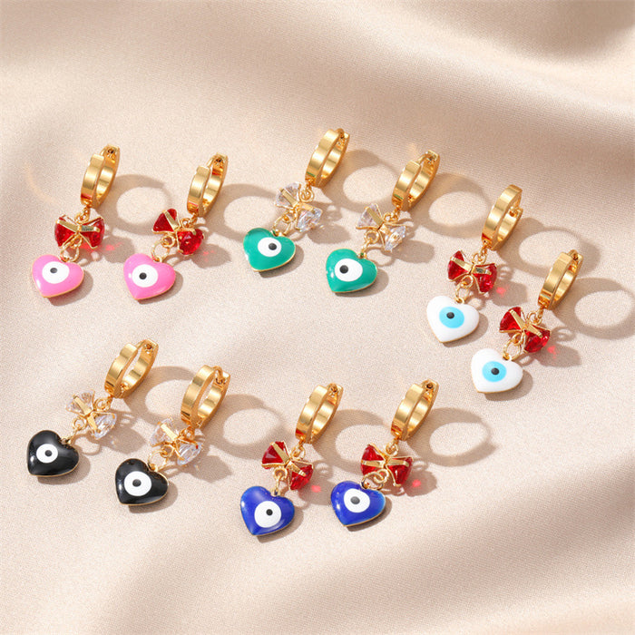 Gold Tone Bow and Heart Evil Eye Huggie Drop Earrings