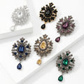 Teardrop Glass Brooch With Ornate Antique Tone Crystal Frame view 2