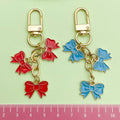 Three Bow Charm Keychain in Red or Blue with Gold Tone Clasp view 4