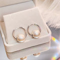 Silver Tone Hoop Earrings with Matte Round Bead Charm view 1