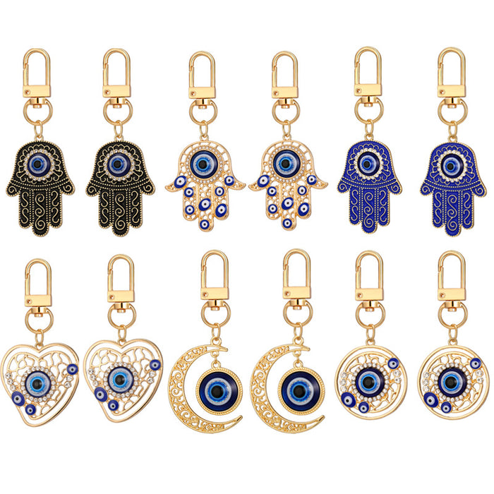 Twelve Piece Gold Tone Hamsa Heart and Crescent Evil Eye Keychain Set