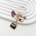 Black Handbag Lipstick Heel and Pearl Charm Keychain view 2