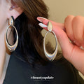 Open Oval Sculptural Drop Earrings In Gold And Silver Tone view 4