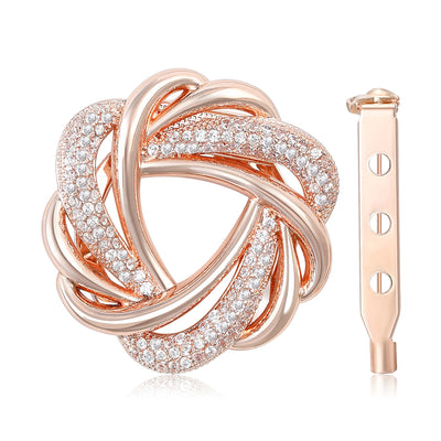 Front view of rose gold interwoven knot brooch with crystal-covered bands against a white background.