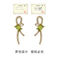 Gold Tone Green Stone Bow Stud Earrings Clear Pavé Accents view 3