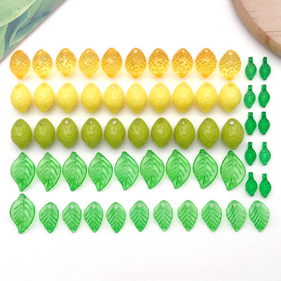 Multicolor lemon and leaf beads arranged on a light background