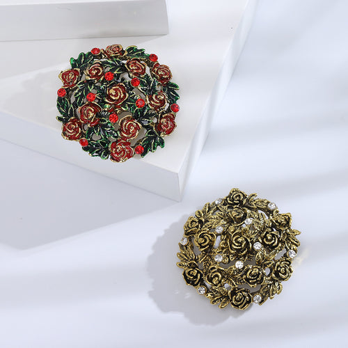 Front view of round rose garden brooch with crystal accents decorative metal pin