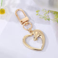 Gold and Silver Tone Assorted Symbol and Character Clip Keychains view 9