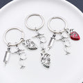 Six Silver Tone Medical Tool and Heart Keychains with Metal Hardware view 3