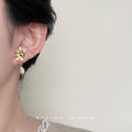Gold Asymmetric Flower Studs One with Baroque Pearl Drop view 2