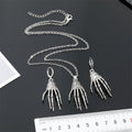 Silver Tone Skeleton Hand Pendant Necklace and Huggie Earrings view 4