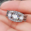 Oval Halo Crystal Ring with Triple Row Silver Tone Band view 1
