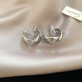 Interlocking Double Hoop Clip On Earrings in Gold and Silver view 6