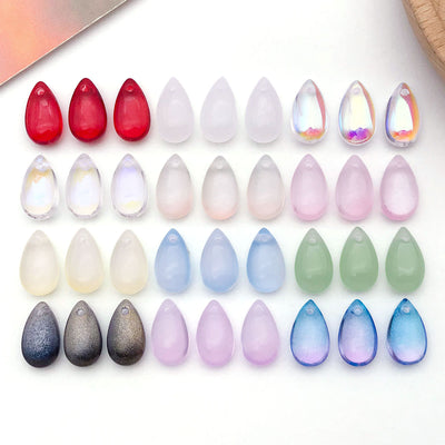 Metallic assorted shape charms arranged on a light background
