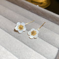White Flower Hook Earrings in Silver and Gold with Polished Metal Details view 7