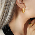 Twisted Chunky Hoop Earrings Gold and Steel Finishes view 4